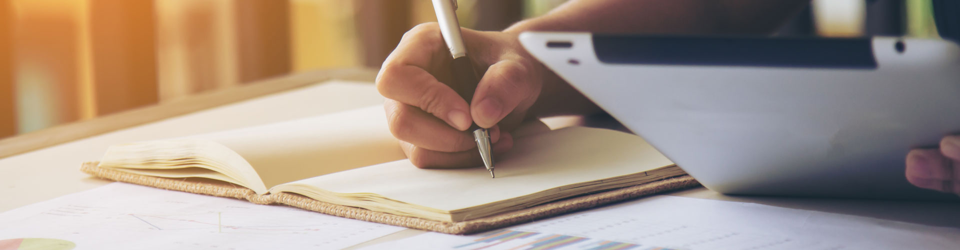 Bride wearing corset style wedding dress with mother helping her get ready